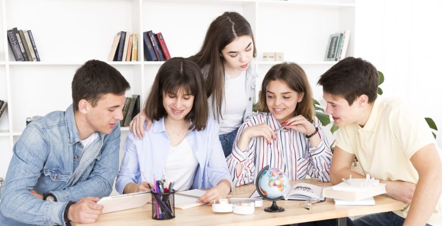 students-studying-together-library
